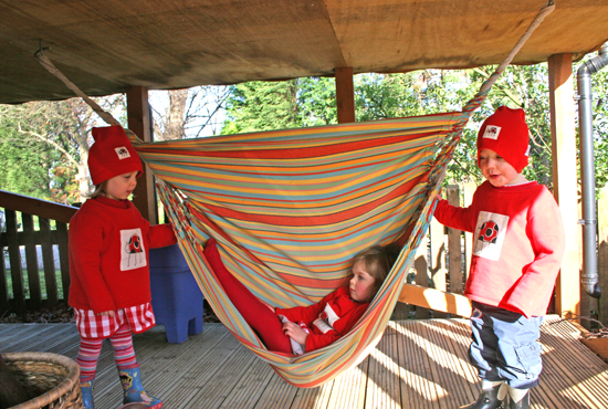 Playing under the treehouse